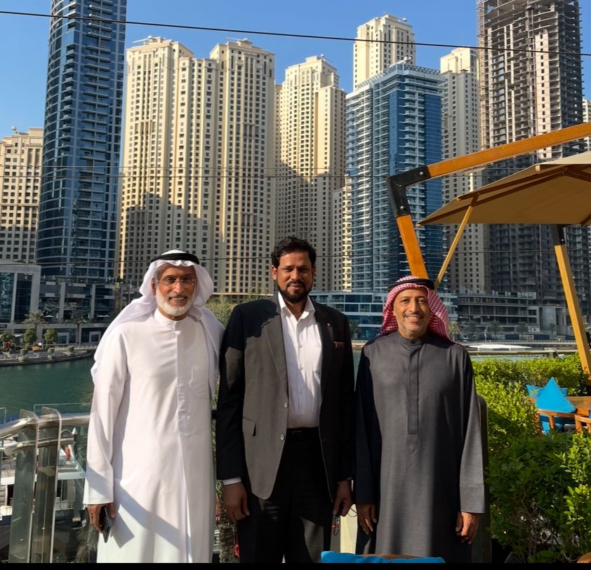 With business associates at Dubai Marina