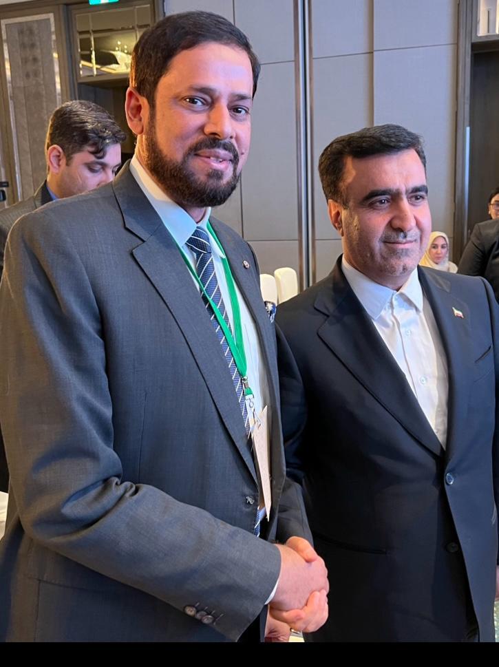 With a delegate from Iran at an international summit